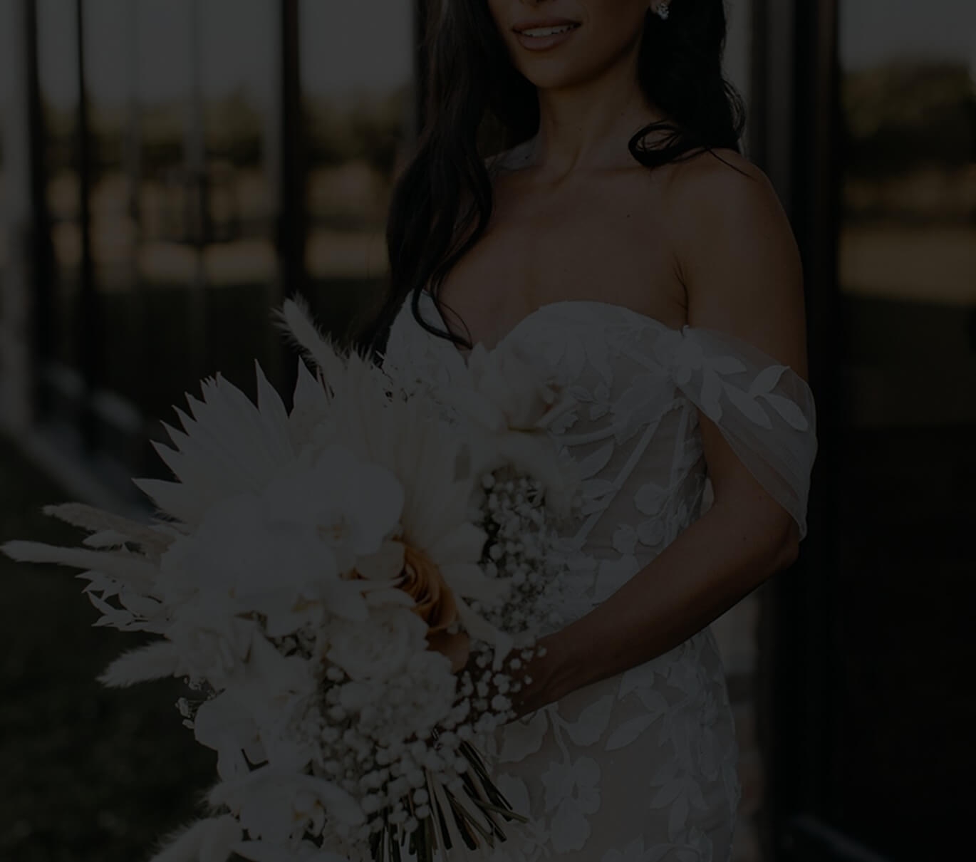 Сouple wearing a white gown and a black suit